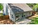 Aerial shot of backyard, including patio, lawn, fence, and home exterior at 1608 Hayesville Dr, Fuquay Varina, NC 27526