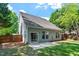 Back exterior view of the home showcasing the yard, patio, siding, and windows at 1608 Hayesville Dr, Fuquay Varina, NC 27526