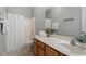 Bathroom with wooden cabinets, neutral paint, and soft lighting at 1608 Hayesville Dr, Fuquay Varina, NC 27526