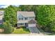 Charming home featuring lush landscaping, a two-car garage, and a well-manicured front yard at 1608 Hayesville Dr, Fuquay Varina, NC 27526