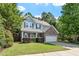 Beautiful two-story home with a well-maintained lawn, stone accents, and a two-car garage at 1608 Hayesville Dr, Fuquay Varina, NC 27526