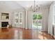 Living room featuring hardwood floors, a fireplace and backyard access through sliding glass door at 1608 Hayesville Dr, Fuquay Varina, NC 27526