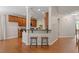 Open-concept living room with hardwood floors and breakfast bar at 1608 Hayesville Dr, Fuquay Varina, NC 27526