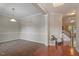 Elegant living room featuring hardwood floors, and access to the second floor at 1608 Hayesville Dr, Fuquay Varina, NC 27526