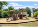 playground with climbing structures and slides on a mulch surface at 1608 Hayesville Dr, Fuquay Varina, NC 27526
