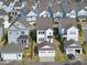 Aerial view of neighborhood featuring modern homes, garages and well-maintained yards at 1616 Silo Ridge Dr, Wake Forest, NC 27587