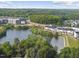 Scenic aerial view of a community with lake, walking paths and lush green trees at 1616 Silo Ridge Dr, Wake Forest, NC 27587
