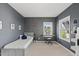 Bedroom features gray walls with keyboard and ample natural light at 1616 Silo Ridge Dr, Wake Forest, NC 27587