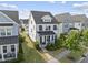 Aerial view of a charming home with lush landscaping, a well-manicured lawn, and a welcoming front porch at 1616 Silo Ridge Dr, Wake Forest, NC 27587