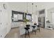 Spacious kitchen with marble island, stainless steel appliances, gray backsplash, and modern pendant lighting at 1616 Silo Ridge Dr, Wake Forest, NC 27587