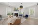 Cozy living room with hardwood floors, fireplace, and comfortable seating arrangements at 1616 Silo Ridge Dr, Wake Forest, NC 27587