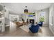 Spacious living room with fireplace, hardwood floors, and modern furnishings at 1616 Silo Ridge Dr, Wake Forest, NC 27587