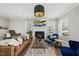 Bright living room with fireplace, hardwood floors, and modern furnishings at 1616 Silo Ridge Dr, Wake Forest, NC 27587