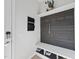 Hall tree with hooks and a shelf provides storage and organization to this stylish mudroom at 1616 Silo Ridge Dr, Wake Forest, NC 27587
