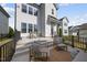 Charming patio with comfortable lounge chairs, an outdoor table, and stylish outdoor decor at 1616 Silo Ridge Dr, Wake Forest, NC 27587