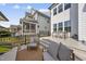 Relaxing patio with comfortable seating, an outdoor dining table, and an inviting ambiance at 1616 Silo Ridge Dr, Wake Forest, NC 27587