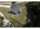Aerial view showcasing the backyard with a screened porch and play area at 199 Courtney Ln, Dunn, NC 28334