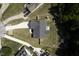 Aerial view showcases the home's roof, yard, driveway, and surrounding landscape and neighborhood at 199 Courtney Ln, Dunn, NC 28334
