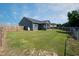 Large backyard featuring a screened porch, patio, and play area at 199 Courtney Ln, Dunn, NC 28334