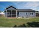Relaxing backyard with screened porch, patio, and comfortable seating at 199 Courtney Ln, Dunn, NC 28334
