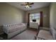 Cozy ' bedroom features twin beds, a dresser, and a bright window with pink curtains at 199 Courtney Ln, Dunn, NC 28334