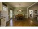 Charming dining room with hardwood floors, a large window, and a decorative light fixture at 199 Courtney Ln, Dunn, NC 28334