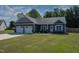 Beautiful home with a manicured lawn, a two-car garage, and attractive exterior architecture at 199 Courtney Ln, Dunn, NC 28334