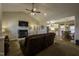 Spacious living room with a fireplace, a dark brown couch, and open to the kitchen at 199 Courtney Ln, Dunn, NC 28334