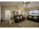 Comfortable living room with vaulted ceiling, a ceiling fan, and plush seating at 199 Courtney Ln, Dunn, NC 28334