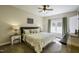 Serene main bedroom with a large window and soothing neutral tones, bedside tables, and lamps at 199 Courtney Ln, Dunn, NC 28334