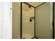 Modern shower features sleek black hardware, clear glass enclosure, and convenient shelving at 199 Courtney Ln, Dunn, NC 28334