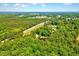 Aerial view shows the location of the property with lush greenery at 206 Kittys Ln, Erwin, NC 28339