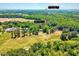 Aerial view showcases the property at 206 Kittys Ln, near Chicora Golf Club, with lush greenery and expansive grounds at 206 Kittys Ln, Erwin, NC 28339