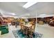 Large basement area with a dining table, pool table, wet bar, and vintage furniture at 206 Kittys Ln, Erwin, NC 28339