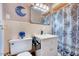 Cozy bathroom featuring a classic vanity and a shower with decorative curtain at 206 Kittys Ln, Erwin, NC 28339