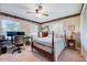 Cozy bedroom with hardwood floors, two windows, and a ceiling fan at 206 Kittys Ln, Erwin, NC 28339