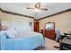 Comfortable bedroom features two windows, ceiling fan, and ample closet space at 206 Kittys Ln, Erwin, NC 28339