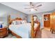 Bright bedroom features a four-poster bed and a rustic nightstand at 206 Kittys Ln, Erwin, NC 28339