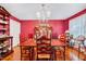 Elegant dining room with wood floors, a chandelier, and ample seating for entertaining at 206 Kittys Ln, Erwin, NC 28339