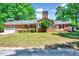 Charming brick home featuring a well-maintained lawn, beautiful landscaping, and inviting curb appeal at 206 Kittys Ln, Erwin, NC 28339