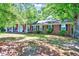 Lovely brick home showcasing mature trees and a covered front porch with classic appeal at 206 Kittys Ln, Erwin, NC 28339