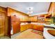 Retro kitchen with wood cabinets, laminate countertops, and vintage appliances at 206 Kittys Ln, Erwin, NC 28339
