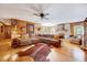 Cozy living room with hardwood floors, brick fireplace, and comfortable, oversized seating at 206 Kittys Ln, Erwin, NC 28339