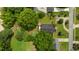 Aerial view of the property showcasing the house, surrounding greenery, and neighborhood layout at 209 E Winston St, Youngsville, NC 27596