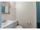 Bathroom featuring beadboard walls, a toilet, and a white sink and vanity at 209 E Winston St, Youngsville, NC 27596