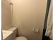 Half bathroom with beadboard style walls at 209 E Winston St, Youngsville, NC 27596