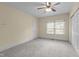 Bedroom with yellow walls and a window, offering potential for personalization at 209 E Winston St, Youngsville, NC 27596