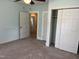 Bedroom features a ceiling fan and access to the closet at 209 E Winston St, Youngsville, NC 27596