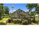 Charming home exterior with a spacious deck, inviting stairs, and lush landscaping at 209 E Winston St, Youngsville, NC 27596