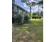 Exterior view of a home with mature trees, showcasing its natural landscape at 209 E Winston St, Youngsville, NC 27596